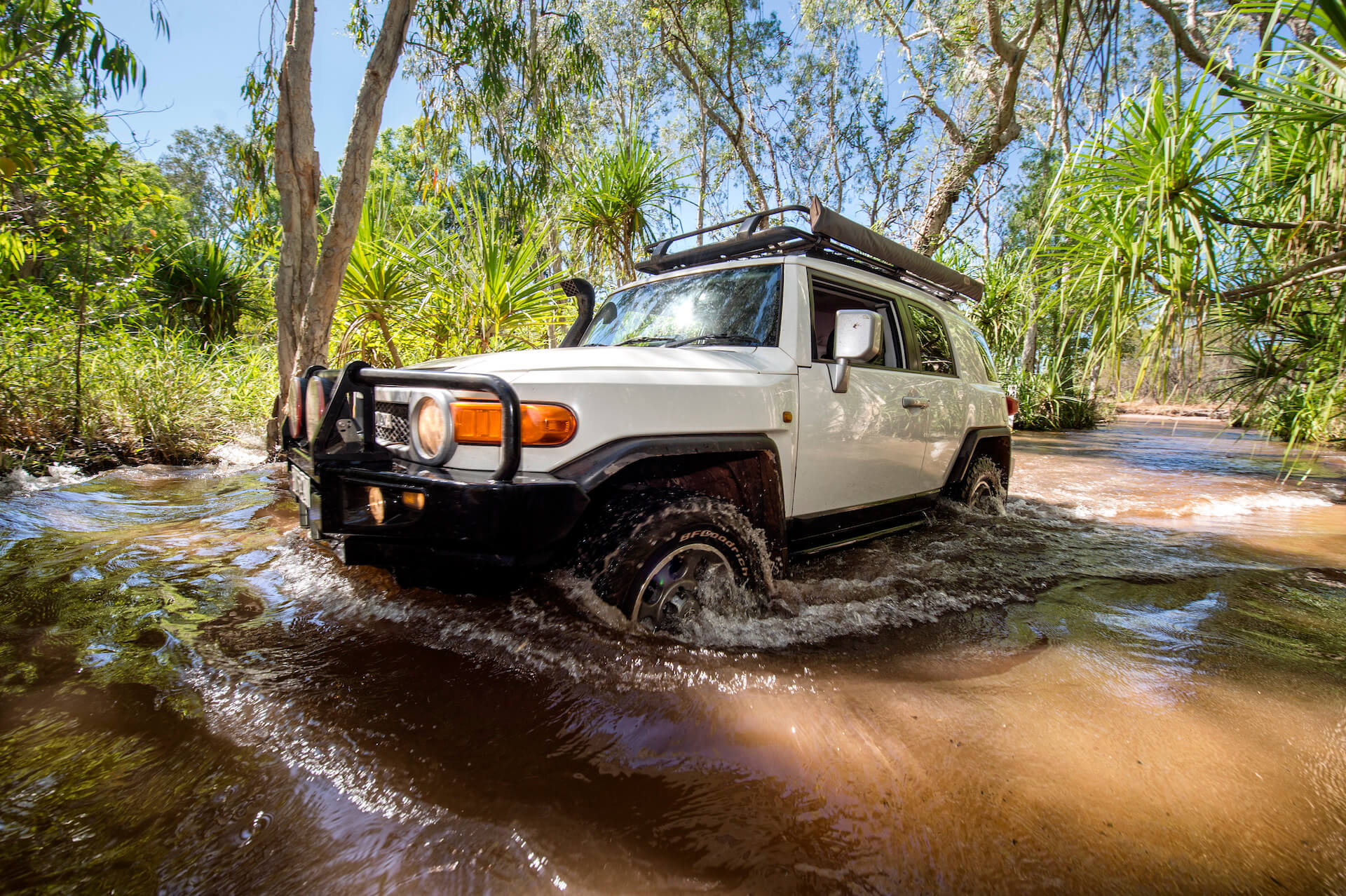 White Pickup Truck In Shallow Jungle Pond, Litchfield, Credit Tourism NT Shaana McNaught.