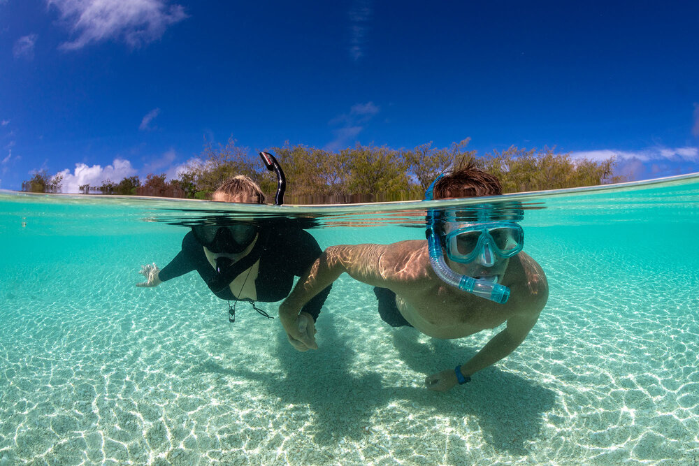 Underwater View of Couple Snorkeling Together, Wilson Island Snorkel, QLD Tourism and Events Queensland. 