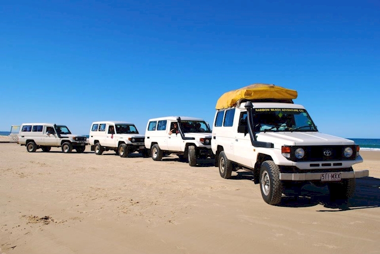 Four White Pickup Trucks On Sand Dirt, 4WD.